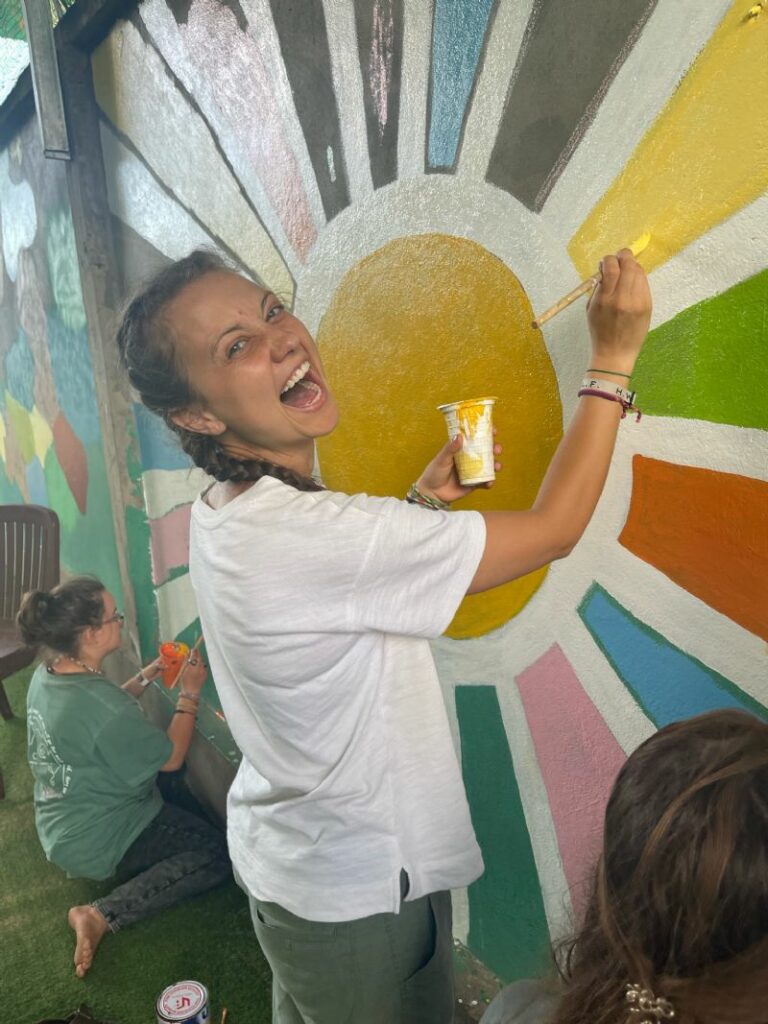 Painting Murals!! The kids have dubbed this one “the rainbow sun” and that brings me a lot of joy!!